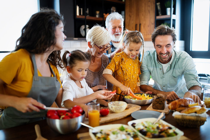 Multigenerational family sharing a meal together in the kitchen